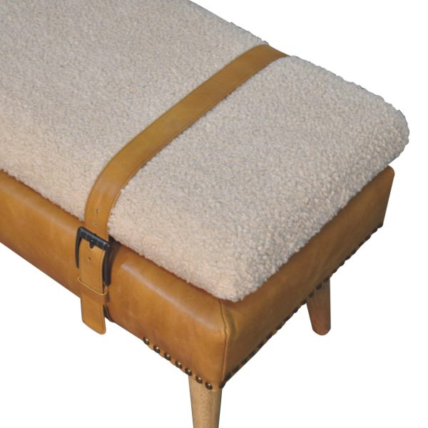 Upholstered bench, cotton and tan leather with belted strap detail.