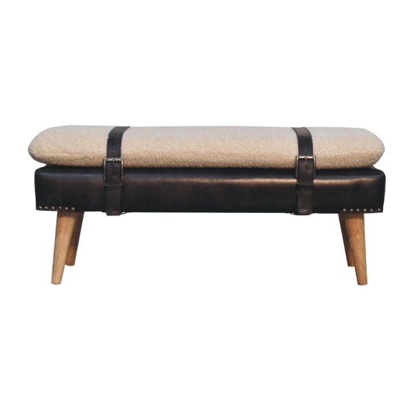 Upholstered bench, angled view with belted strap.