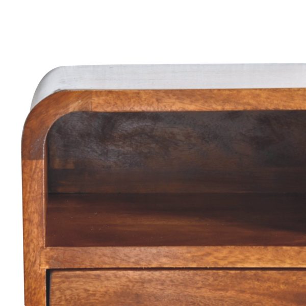 Wooden bedside table close-up, dark brown finish, open shelf, front edge.