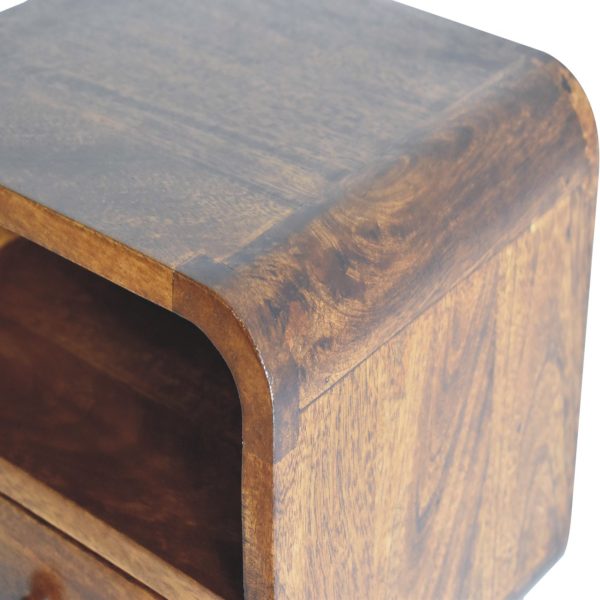 Wooden bedside table close-up, dark brown finish, open shelf, top edge.
