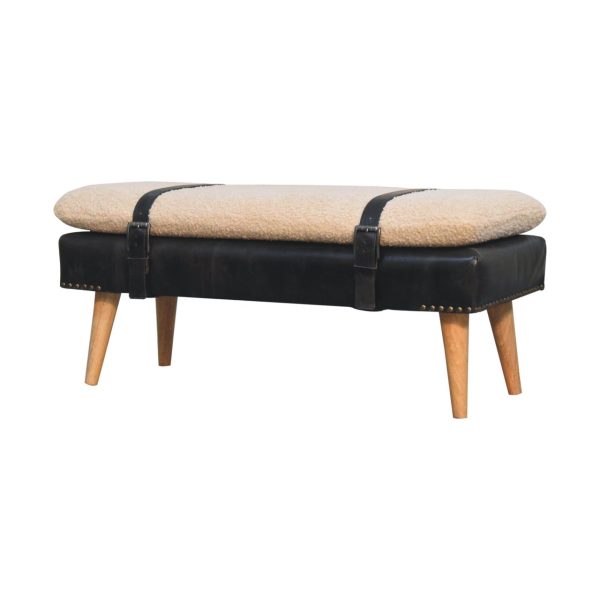 Upholstered bench, front view with belted strap.